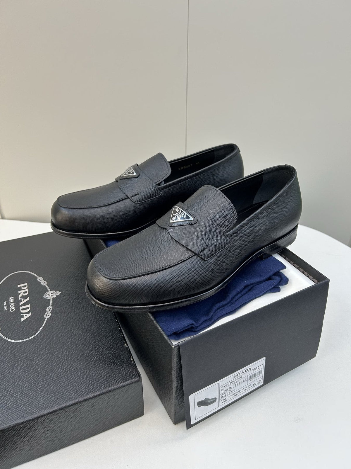 Prada Black Triangular Plaque Loafers